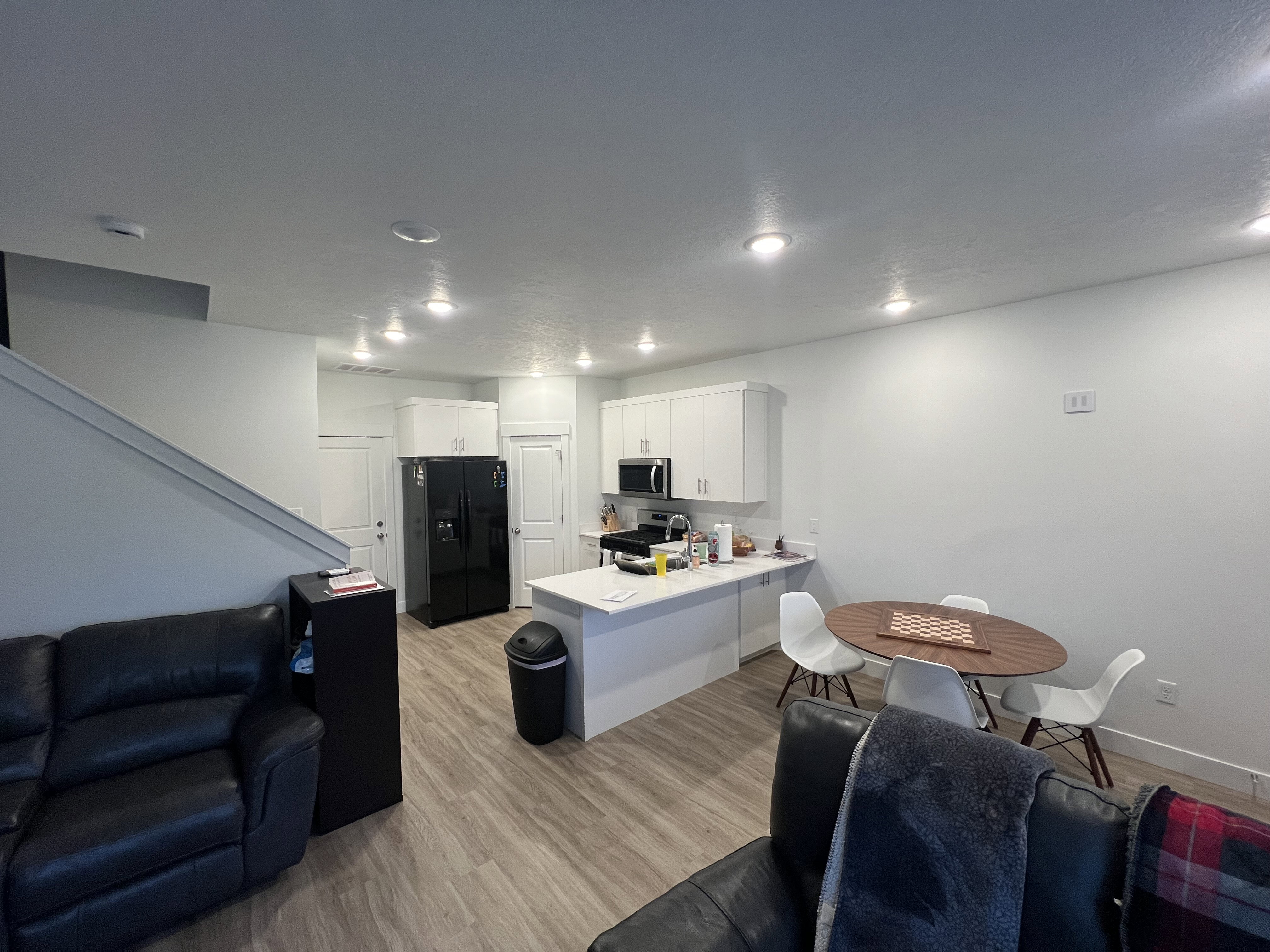 Open-concept living space featuring wood-finish flooring