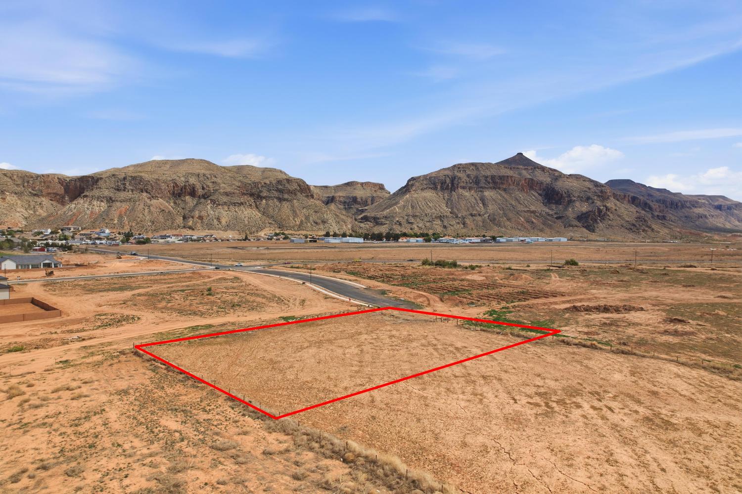 Expansive undeveloped land parcel outlined in red, featuring a flat topography