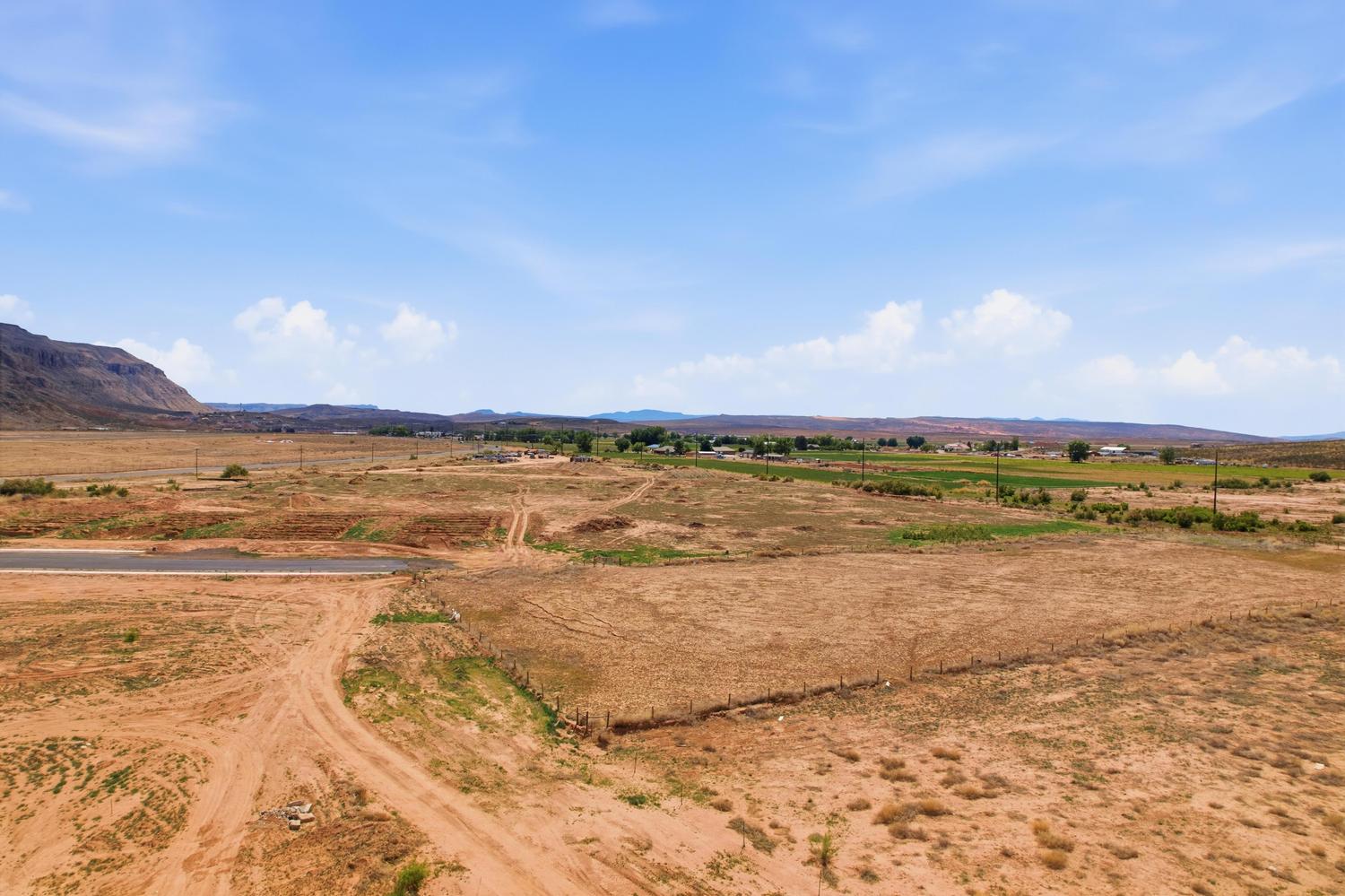 Expansive undeveloped parcel featuring a natural landscape and distant mountain formations