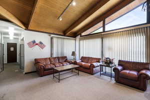 Vaulted wood-paneled ceiling with exposed beams