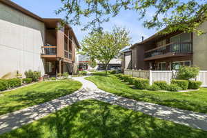 Lush green spaces featuring manicured lawns and mature trees
