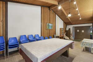 Vaulted wood-paneled ceilings with exposed beams