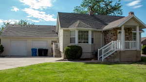 Exterior featuring light-colored siding and a stone facade
