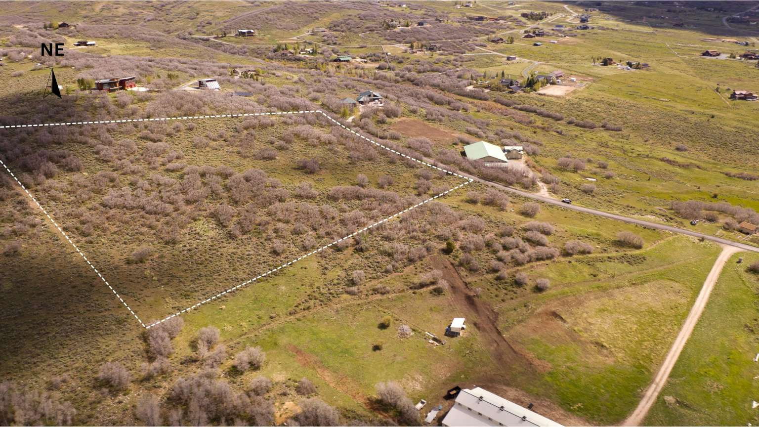 Expansive undeveloped parcel featuring varied topography and natural vegetation