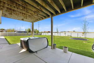 Fenced backyard featuring a patio area