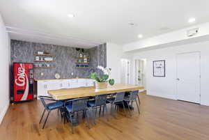 Dining area featuring light wood finished floors and recessed lighting