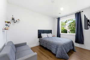 Bedroom with wood finished floors