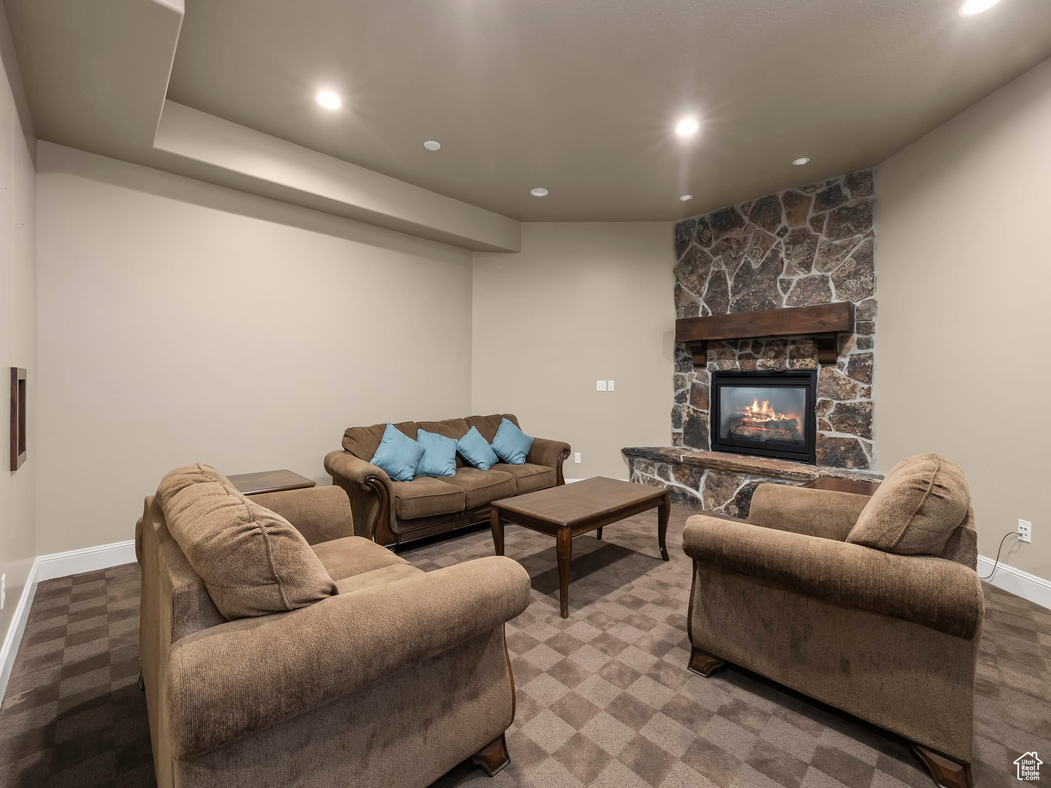 Built-in fireplace with stone surround and wood mantel