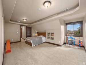 Carpeted room featuring a window with dark wood-finish trim, recessed ceiling lighting, and a built-in shelving unit