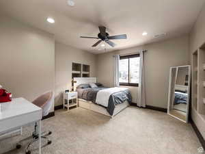 Plush carpeting and a ceiling fan with integrated lighting