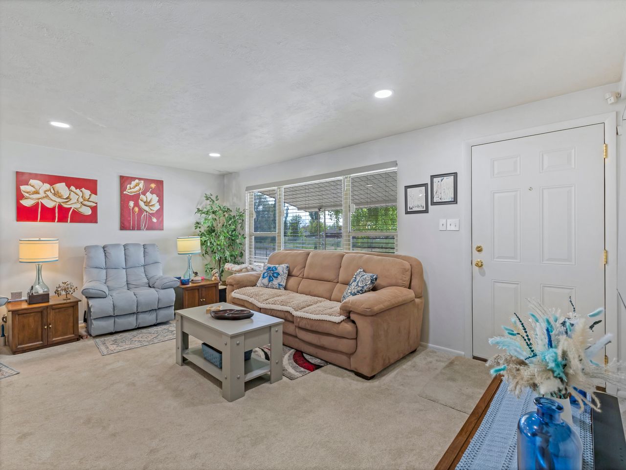Living area featuring recessed lighting and wall-to-wall carpeting