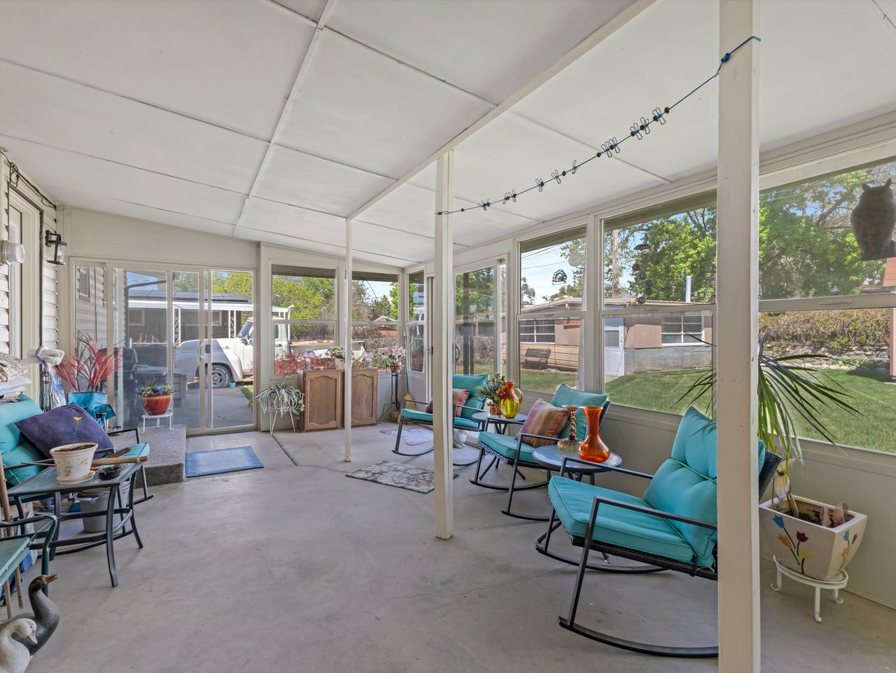 Screened patio with a paneled ceiling and solid flooring