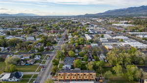 Panoramic aerial perspective showcasing a broad urban landscape with distant mountains