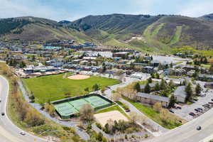 Expansive green space featuring a baseball diamond and football field