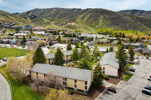 Multi-unit buildings featuring pitched roofs and light-toned facades