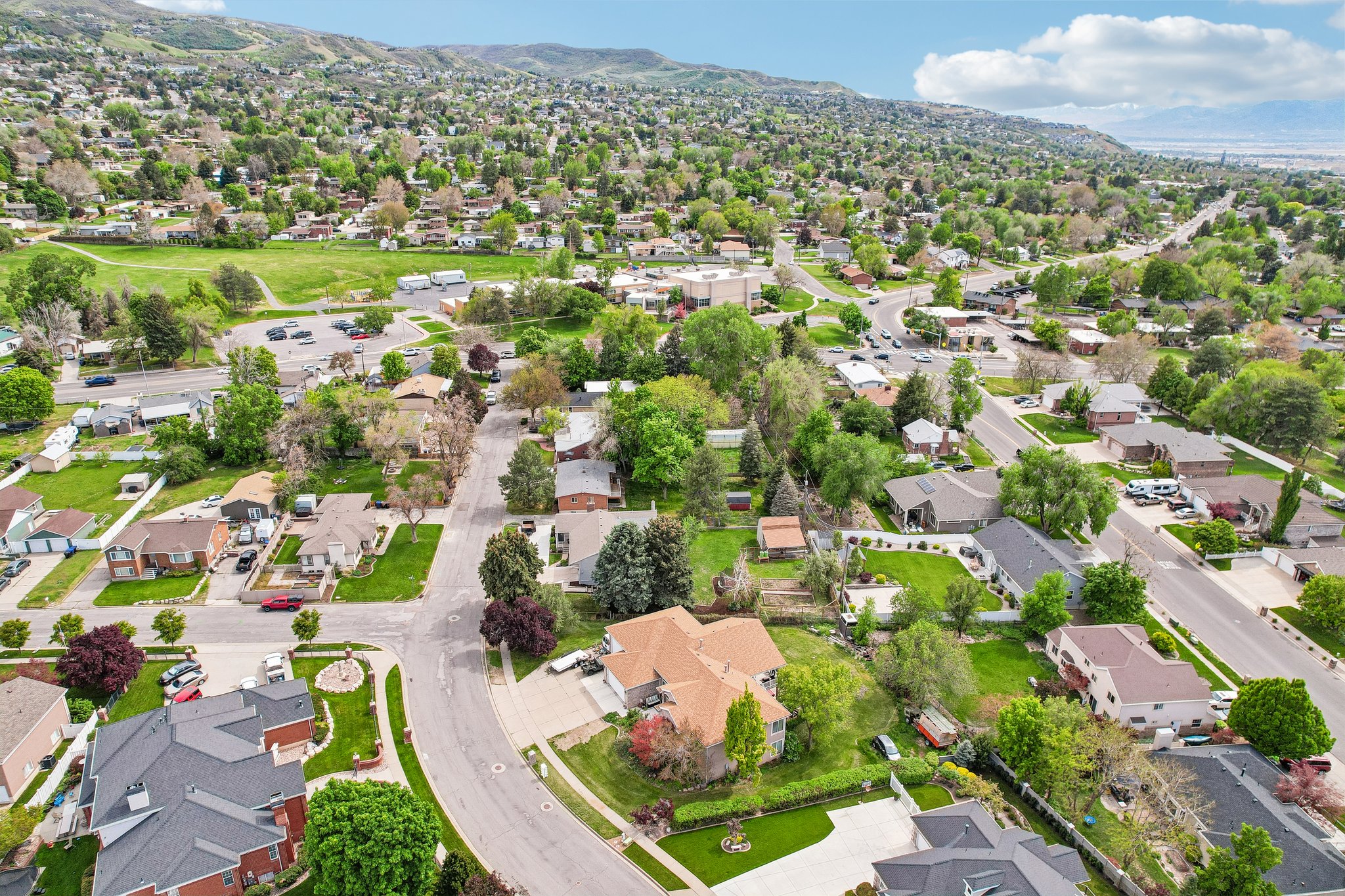 Expansive aerial view of a residential neighborhood featuring established homes with diverse architectural styles