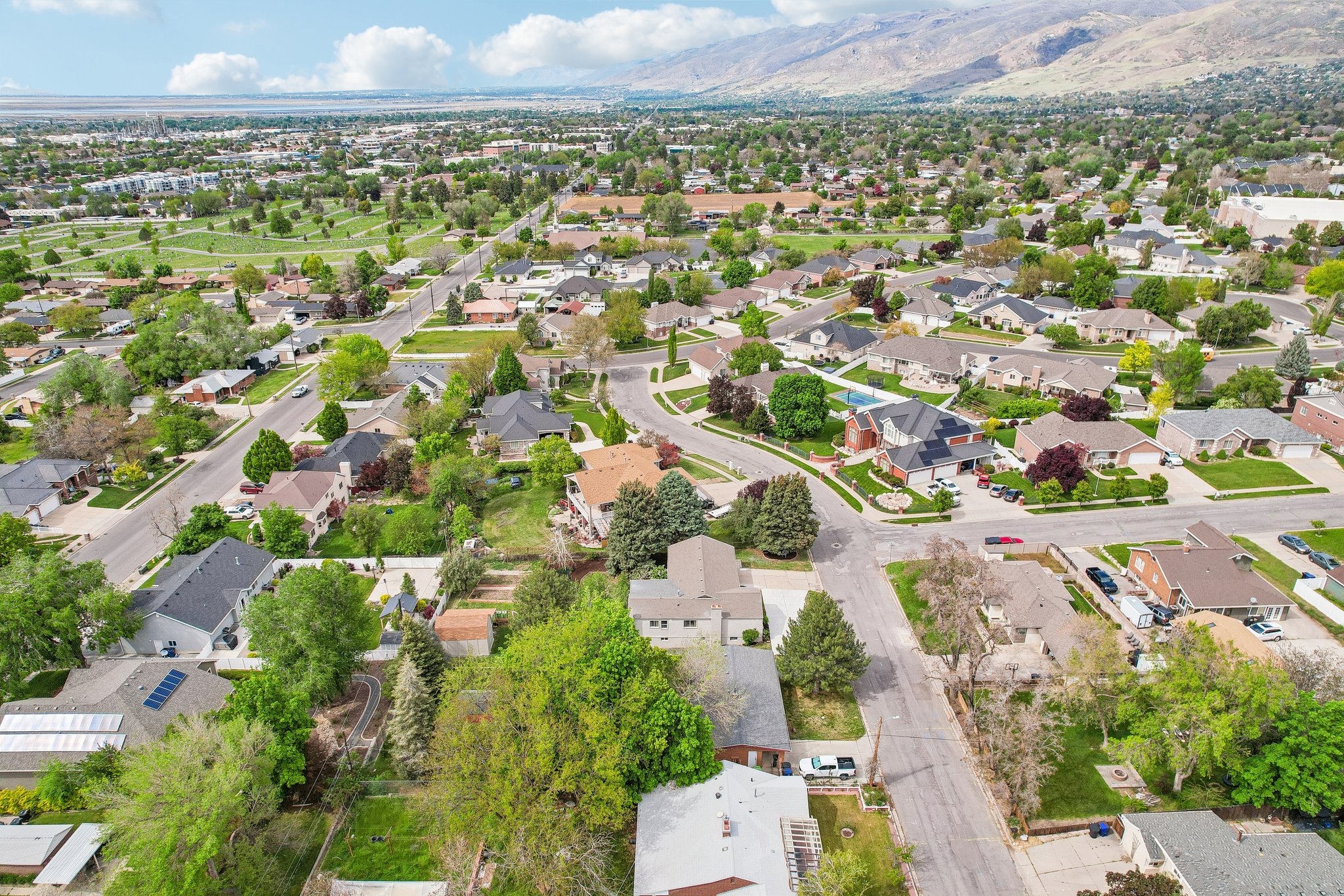 Expansive aerial perspective showcasing a residential neighborhood with varied architectural styles