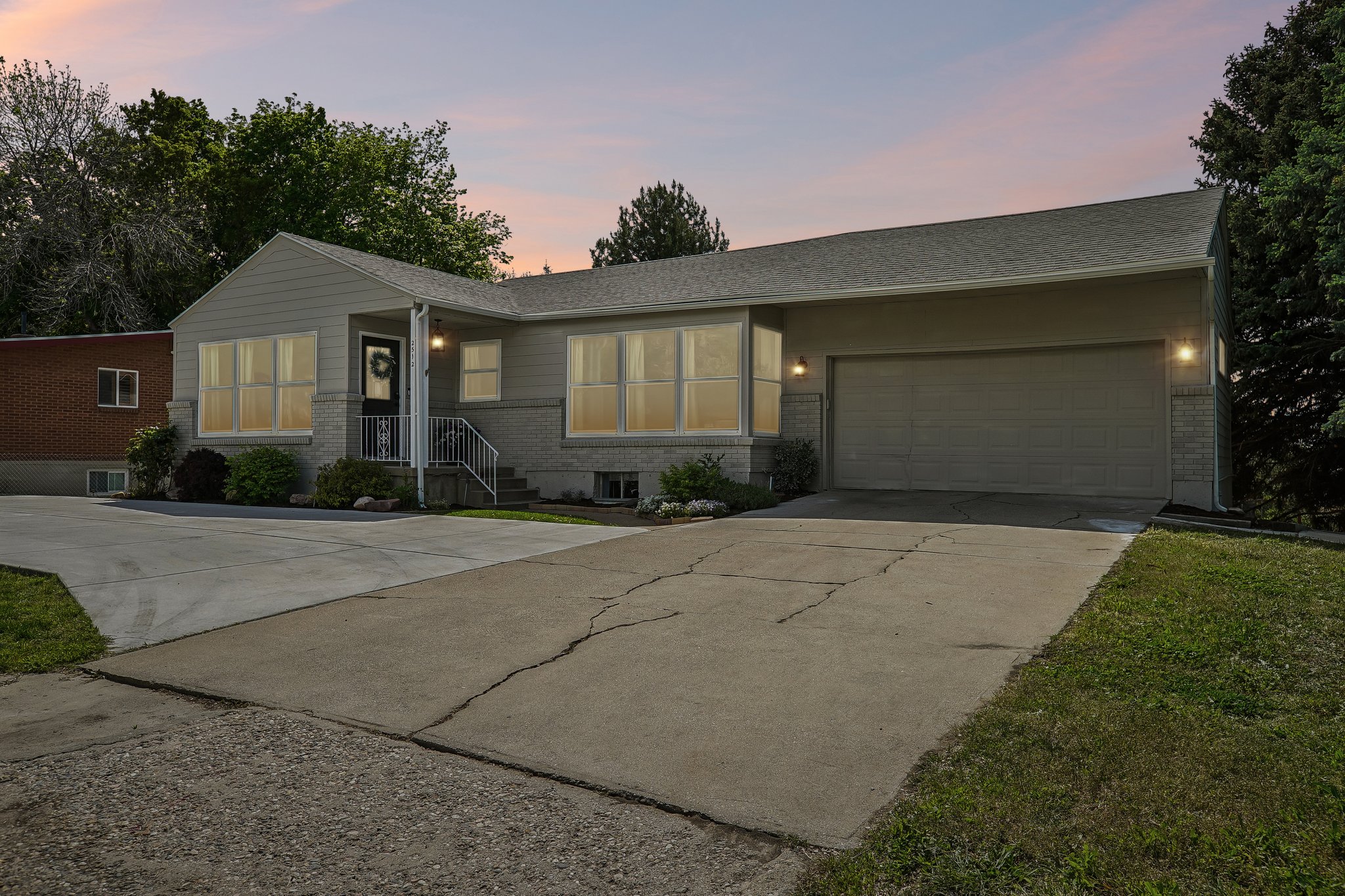 Two-car attached garage with concrete driveway
