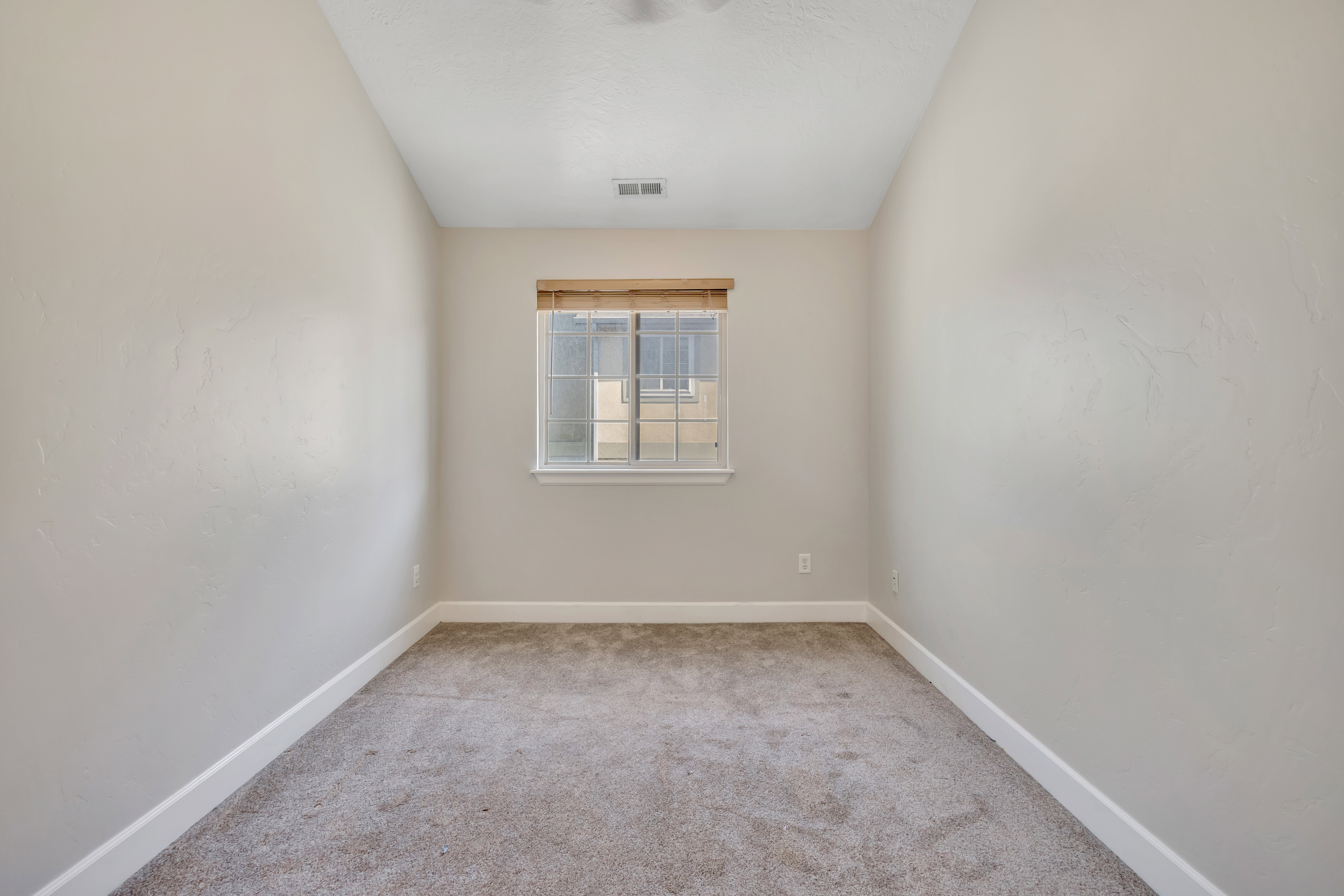 Neutral-toned interior with light gray walls and white baseboards