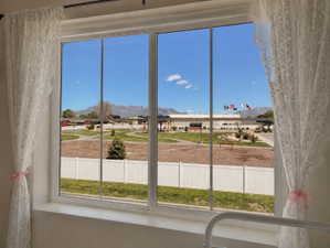 Large multi-pane window framing distant mountains