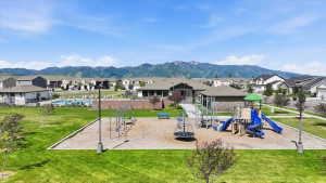 Community playground featuring multiple slides and swings