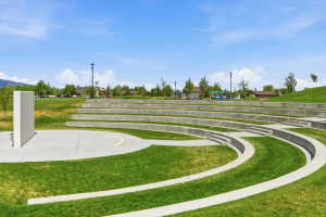 Amphitheater-style seating constructed with concrete tiers and integrated stairways
