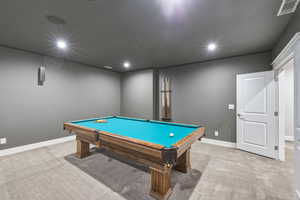 Recreational space featuring a billiard table with a wood frame and teal felt, recessed lighting, wall-mounted speakers, and light-colored carpeting