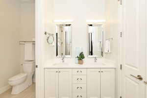 Dual vanity with undermount sinks, quartz countertops, and polished chrome fixtures
