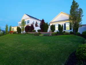 Expansive green lawn with mature landscaping