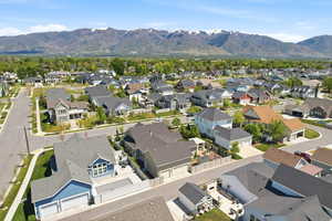 Expansive residential neighborhood with diverse architectural styles, mature landscaping, and paved streets