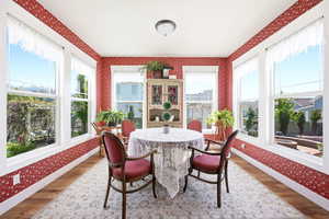 Bright interior space with multiple large windows providing ample natural light