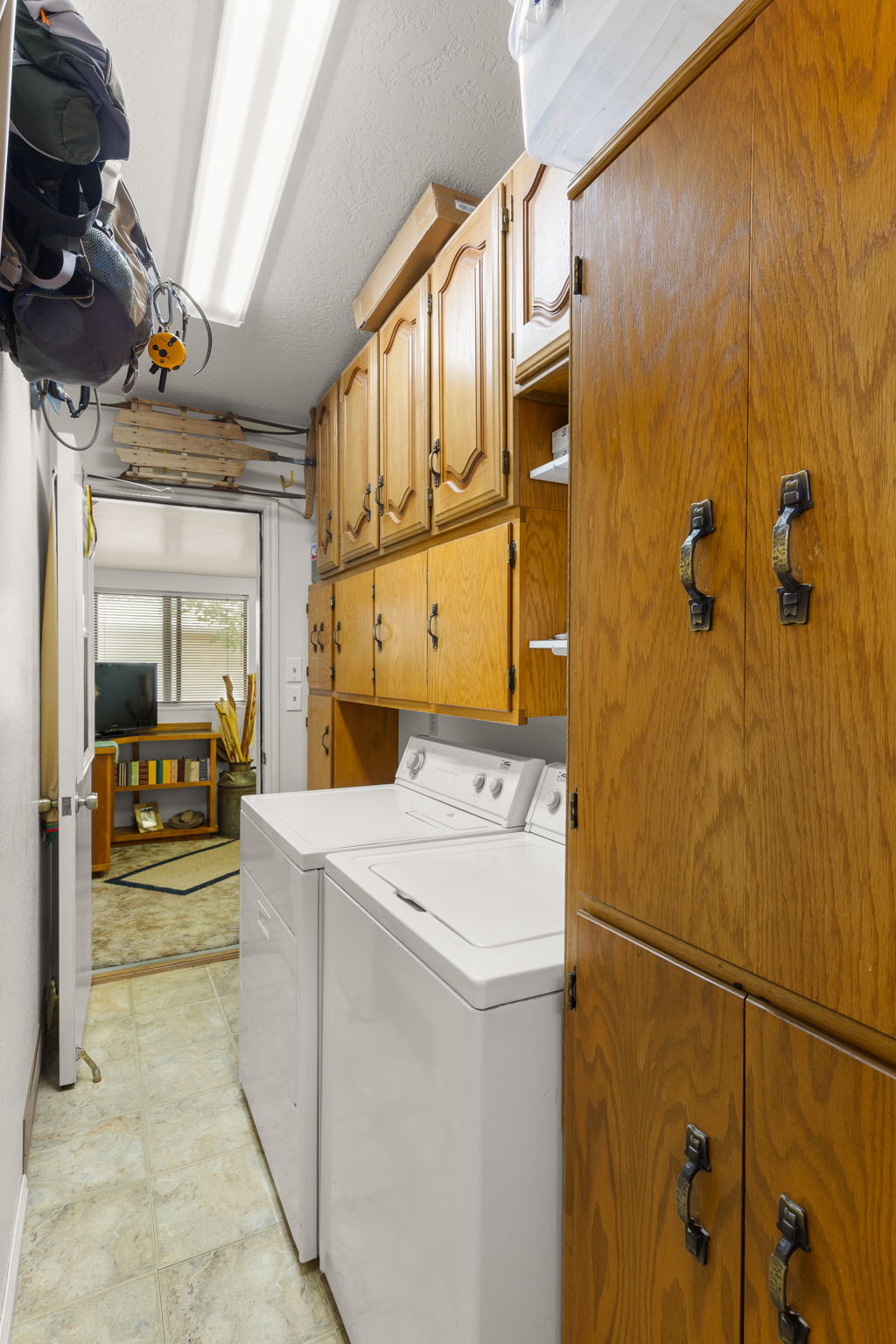 Dedicated laundry area featuring a full-size washer and dryer