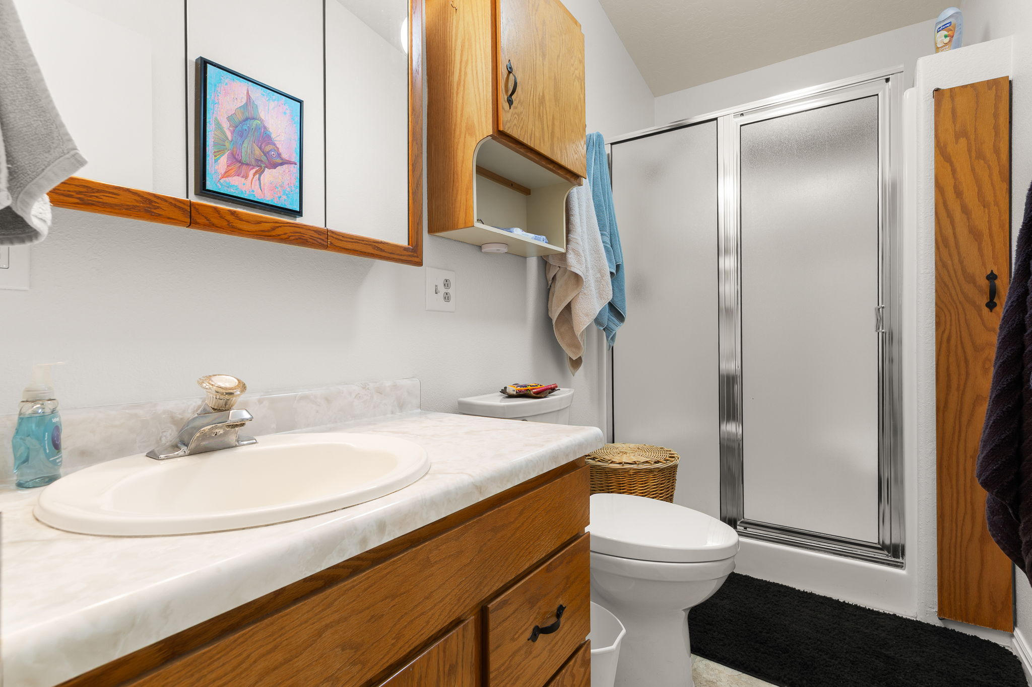 Bathroom featuring a vanity with an integrated sink and laminate countertop