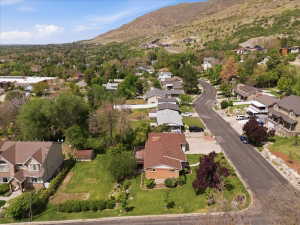 Residential neighborhood featuring a paved street and mature trees