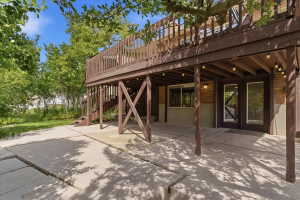 Multi-level deck with a wood railing and staircase