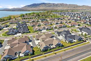 Aerial perspective of suburban area featuring a water and mountain view