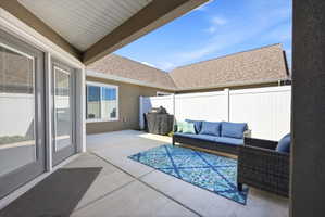 View of patio with a grill and outdoor furniture