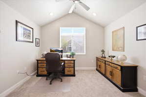 Office space with a ceiling fan, light colored carpet, and recessed lighting