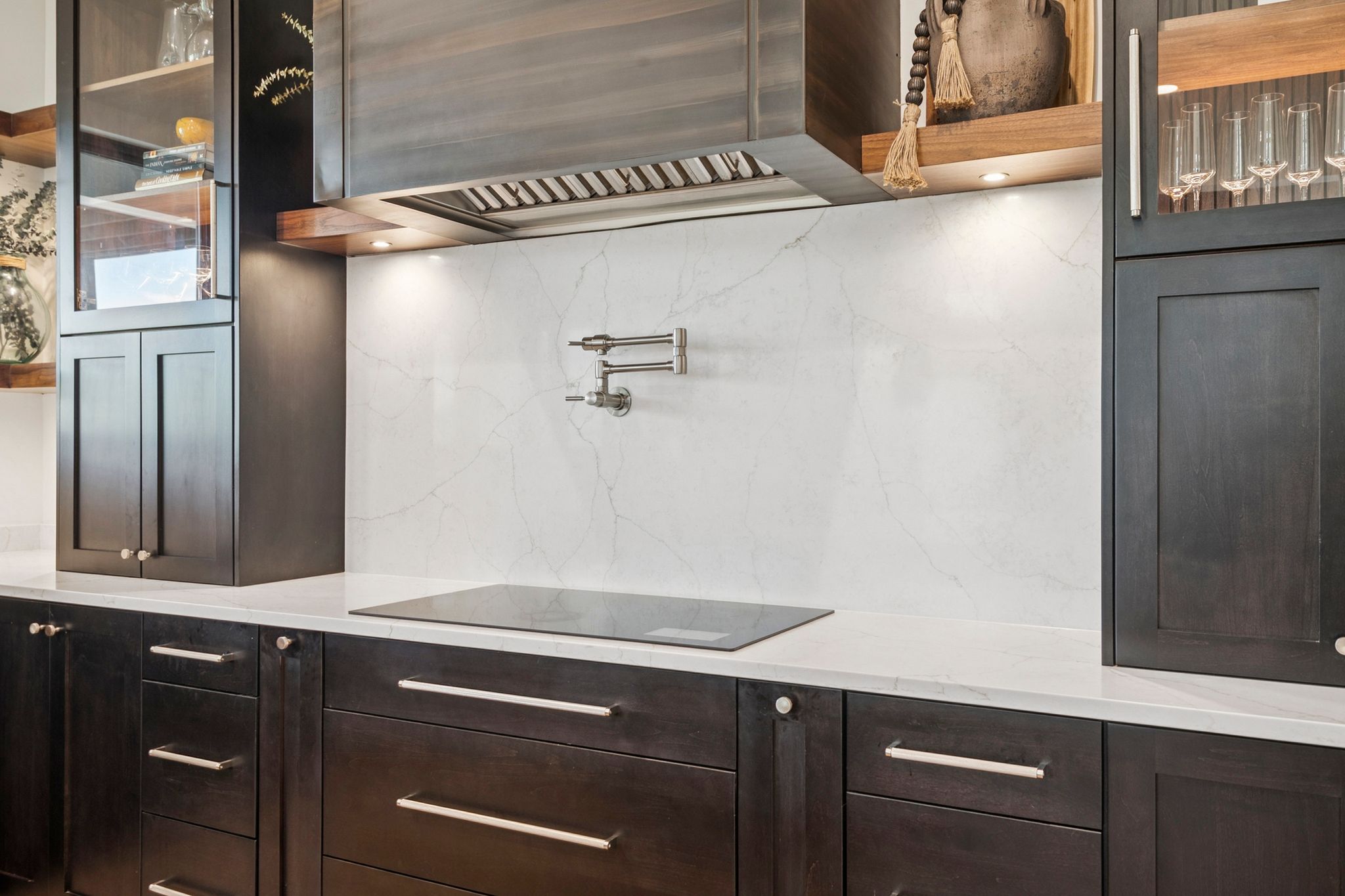 Custom metal hood, Wolf induction cook top, industrial stove vent, and pot filler.