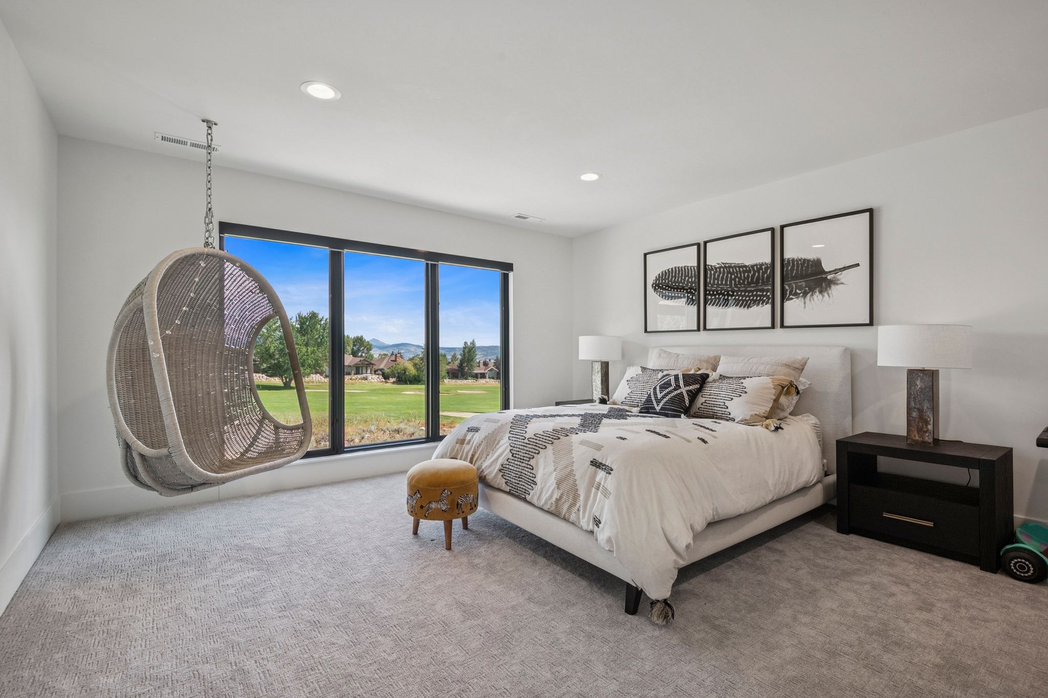 Second extra large primary suite with floor to ceiling windows overlooking golf course and views of the Wasatch range.