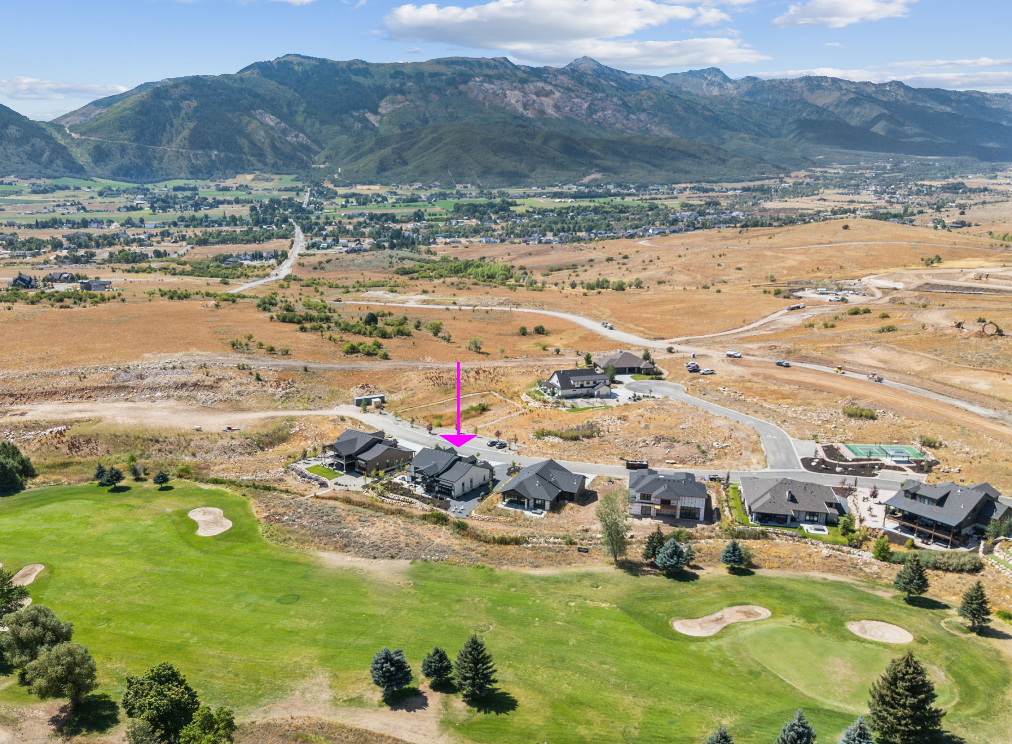 Golf course property on 15th fairway featuring a mountain backdrop and surrounding landscape.