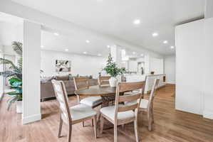 Open-concept living space with wood-finish flooring throughout