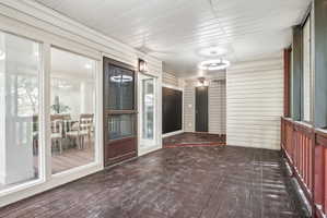 Expansive covered deck with wood-finish flooring