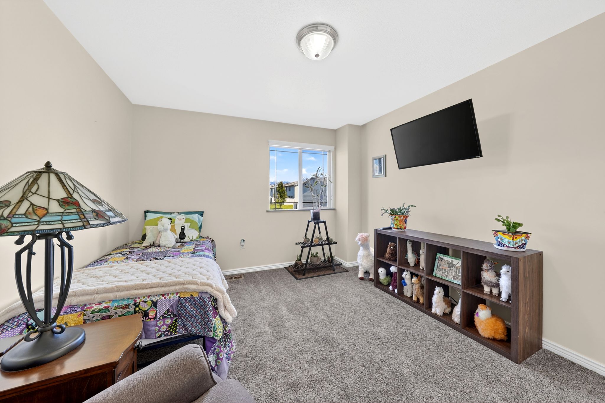 Bedroom featuring carpet floors and baseboards