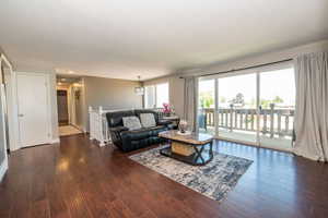 Living area with rich wood-finish flooring