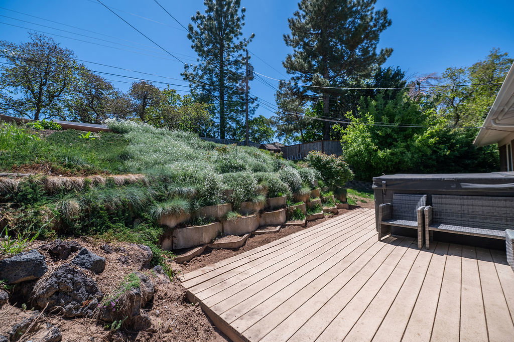 Expansive wood-finish deck with integrated hot tub