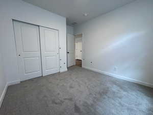 Neutral-toned carpeting paired with white baseboards