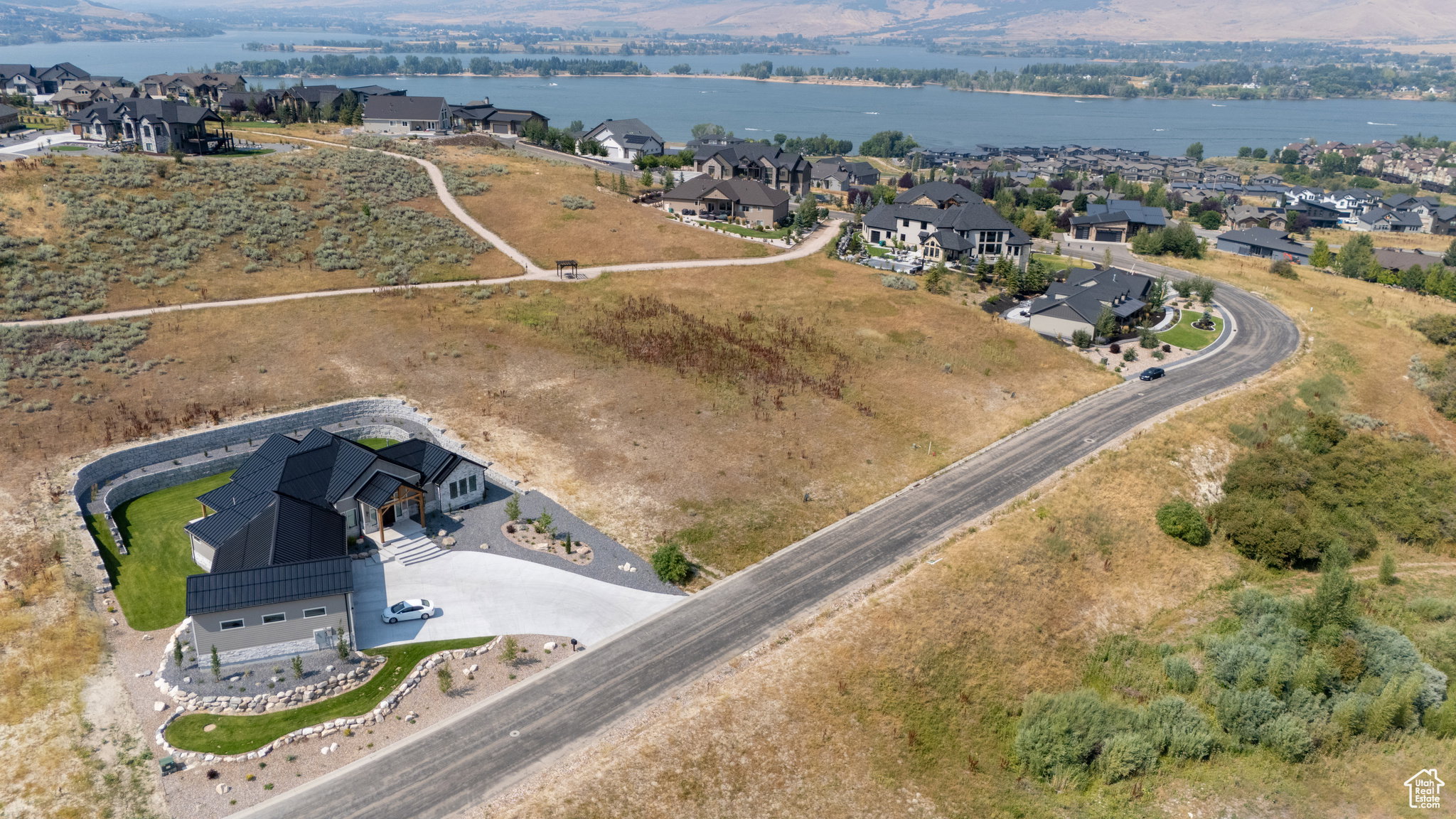 Contemporary architecture with a dark roof and light-toned siding