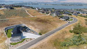 Contemporary architecture with a dark roof and light-toned siding