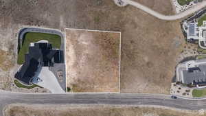 Expansive undeveloped lot featuring a natural landscape, direct road access, and a level building area